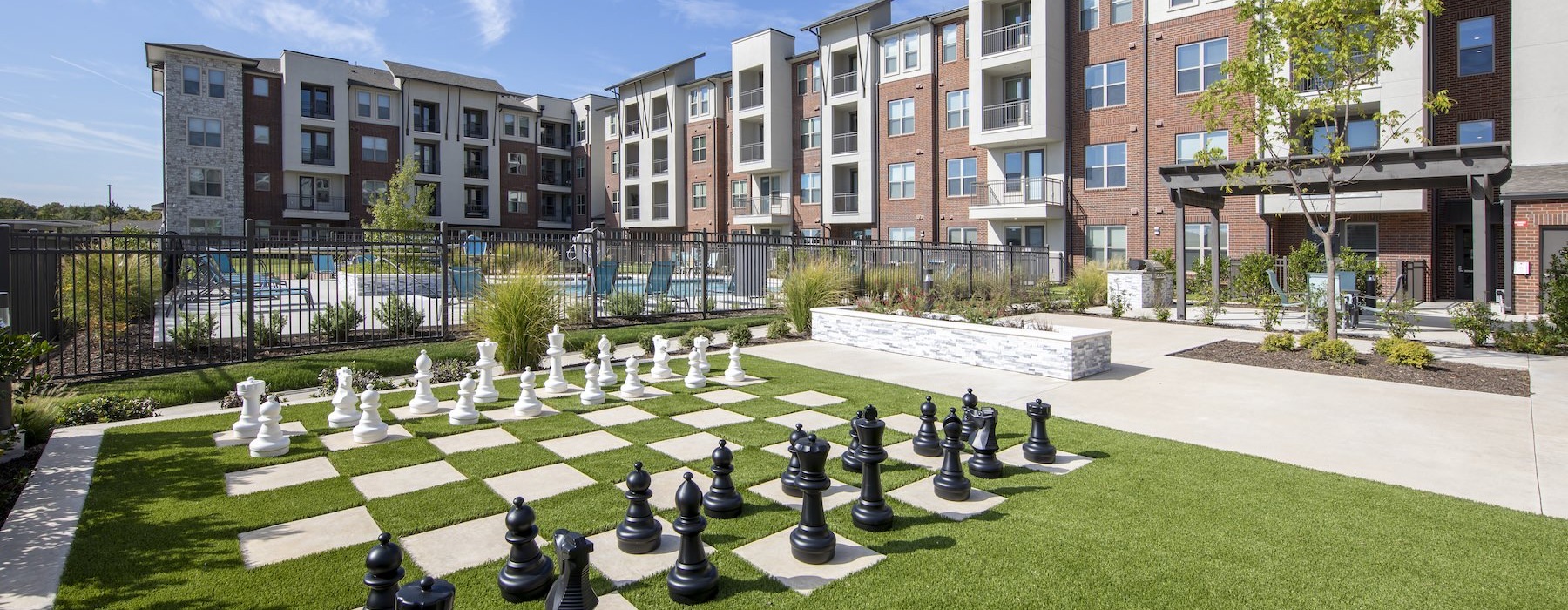 a large chess game in a courtyard