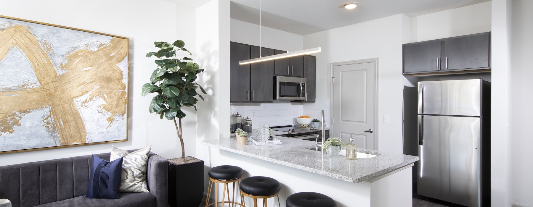 a kitchen with a couch and a table