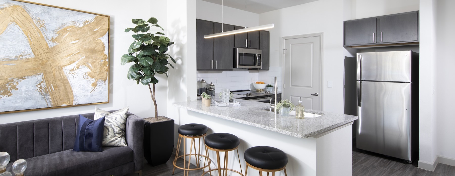 a kitchen with a couch and a table