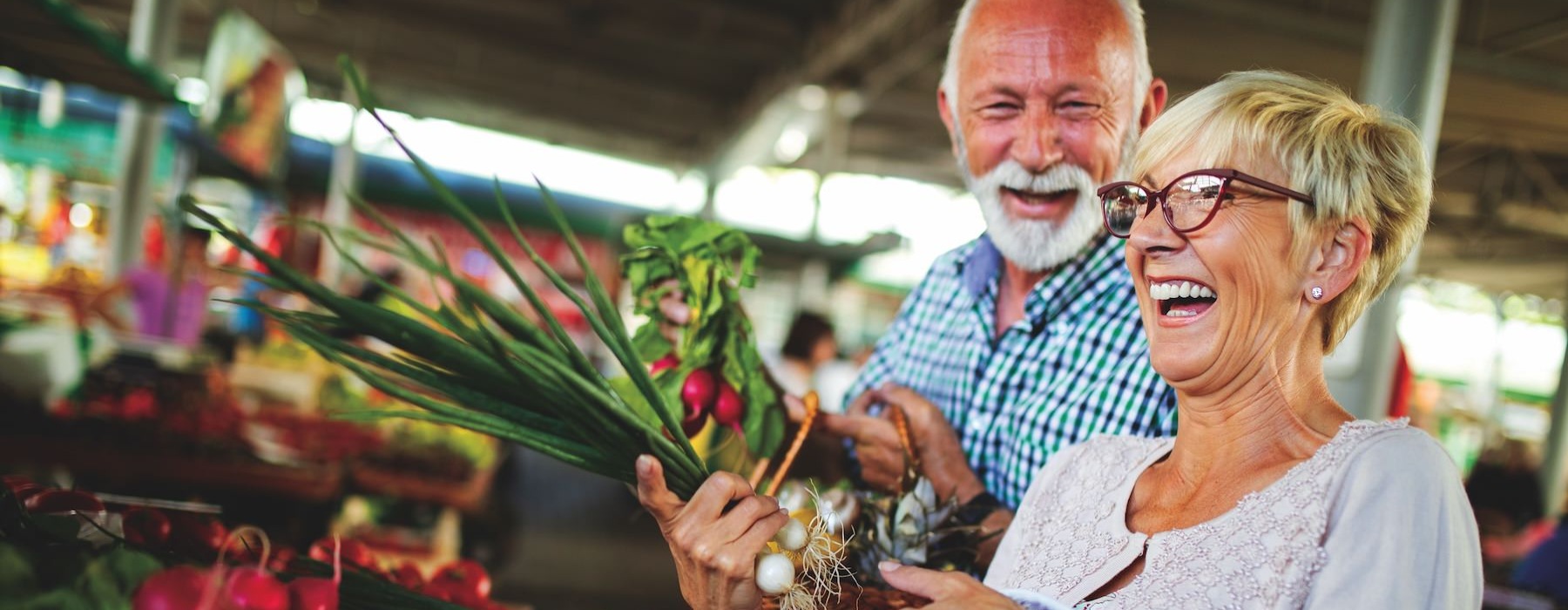 a man and woman holding flowers