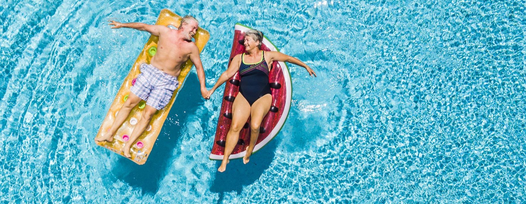 a couple of people in swimsuits in the water